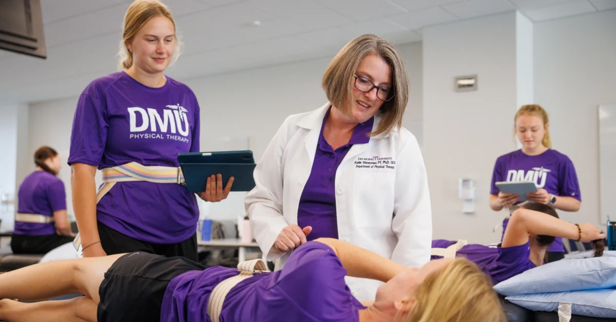 DMU physical therapy students practice during class.