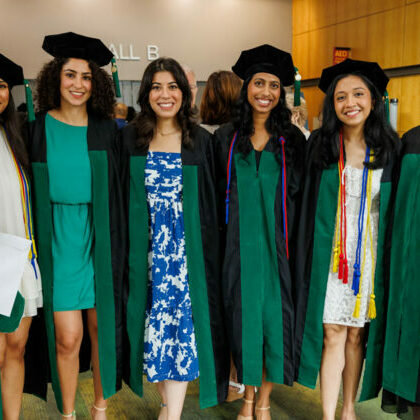 DMU Class of 2024 graduates pose for a photo.